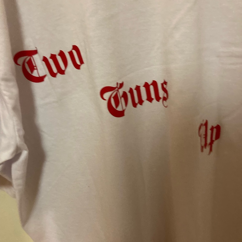White tee shirt/ king gooey/ two guns up
